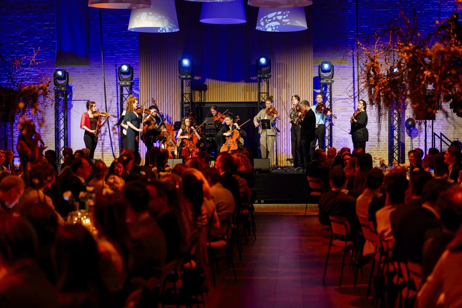 Business dinner with stage, lighting and live music